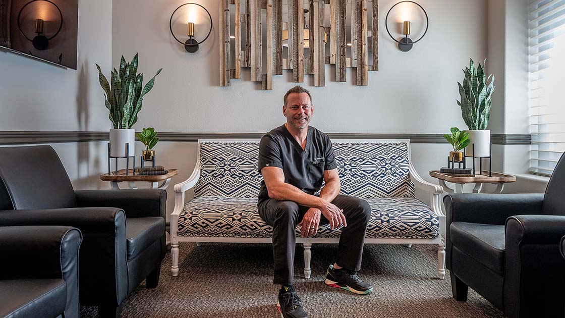 Dr. BARBORKA posing on couch